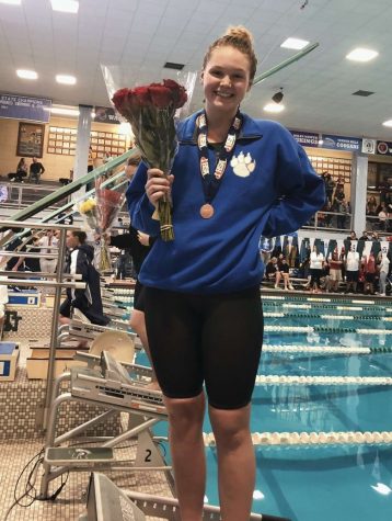 Pictured here is Casey Craffey holding roses after a swim competition.