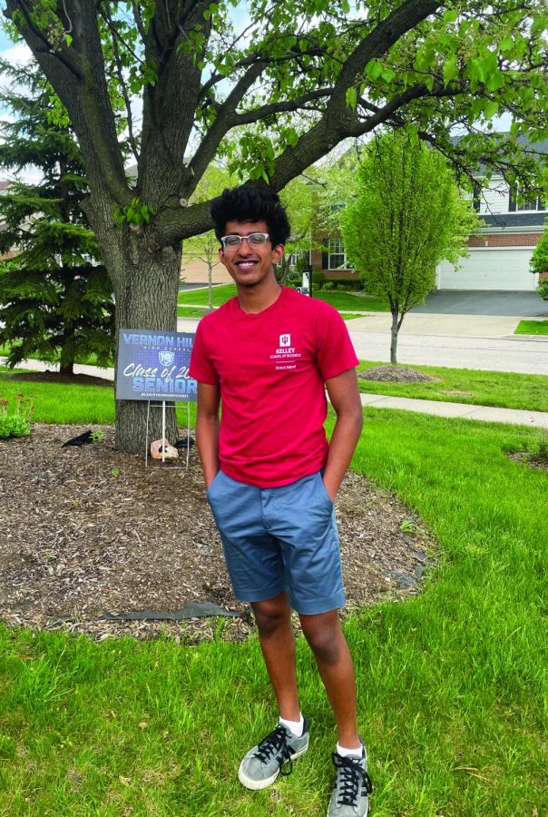 Abhishek stands outside and smiles in an Indiana University t-shirt.