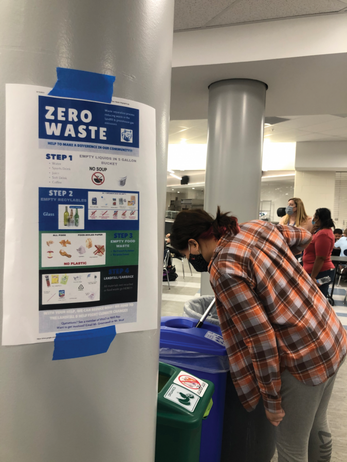Rabiga Abdulleva (12) contributes her National Honor Society service hours by volunteering to sort waste into the appropriate bins during her lunch period.