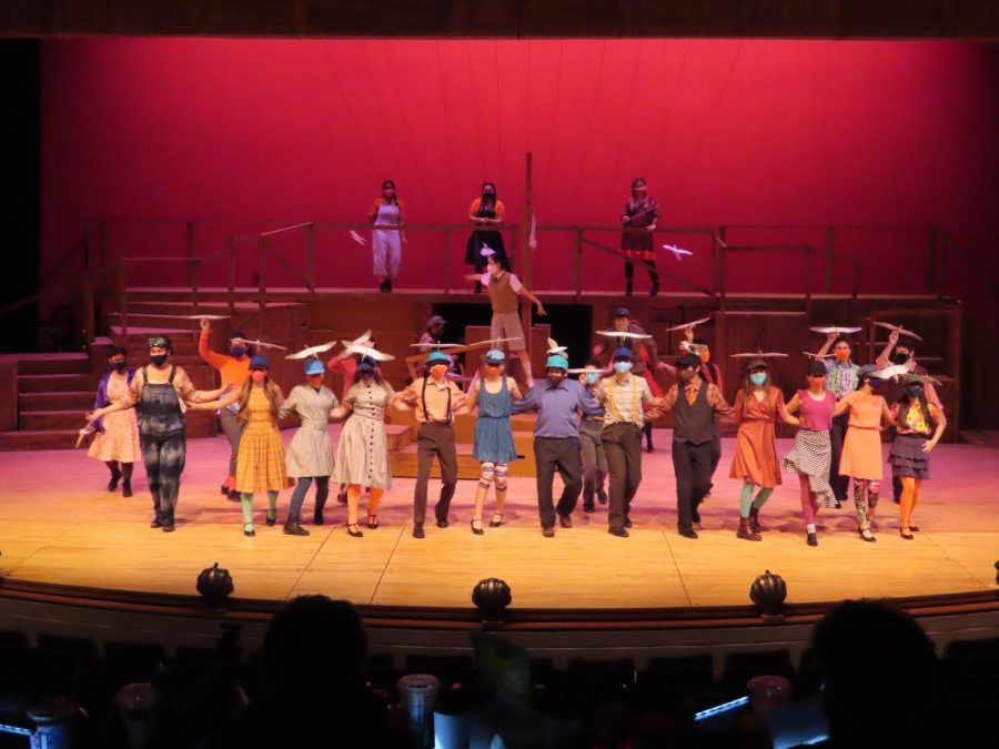 The cast of James and the Giant Peach form a line on stage while dancing during one of their numbers