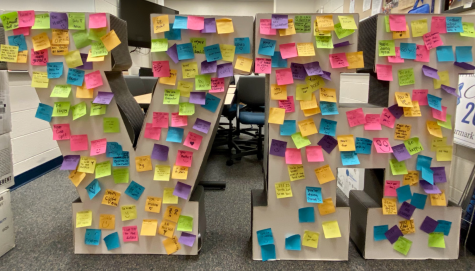 VH sign full of post-its is covered with positive affirmations and kind messages.
