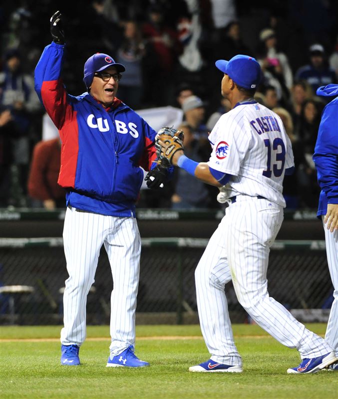 Cubs Manager Joe Maddon and Shortstop Starlin Castro celebrate after a win over the Pittsburgh Pirates.