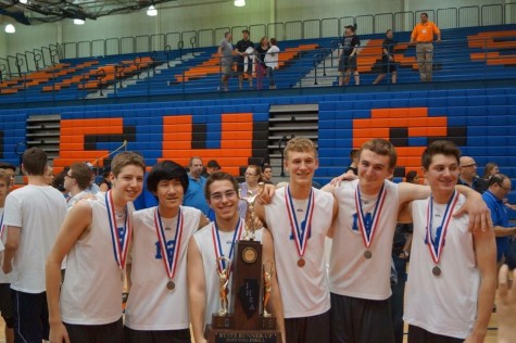 The senior boys pose with last year's second place trophy.