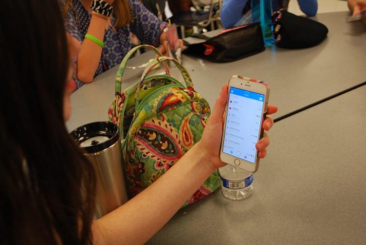 Donalie Black (10) is keeping up her streaks on Snapchat during her lunch period. 