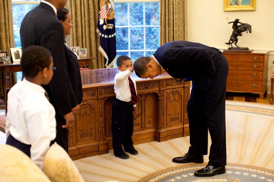 In+the+photo+that+has+hung+in+the+West+Wing+for+three+years%2C+President+Obama+looks+to+be+bowing+to+5-year-old+Jacob+Philadelphia%2C+his+arm+raised+to+touch+the+president%E2%80%99s+hair+%E2%80%94+to+see+if+it+feels+like+his%2C+said+Jackie+Calmes%2C+writer+for+the+New+York+Times.+