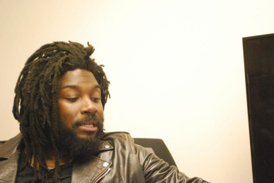 This is a photo of Author Jason Reynolds talking.