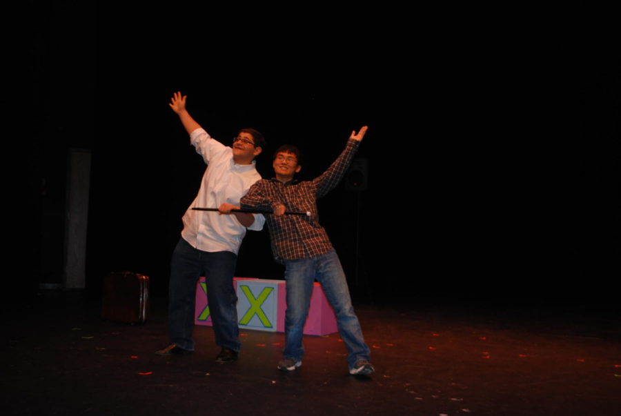 It is a picture of Jack Farag (11) and Micah Kim (11) posing after their duet Perfect Candidate. They are in the studio theatre during their dress rehearsal.