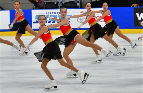 Lauren Costin (middle) competes with her team, Teams Elite