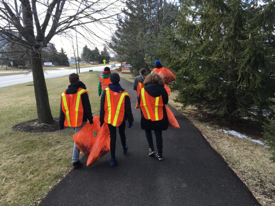 Highway Clean-up Group B walks back to school after cleaning up along Fairway Drive and Arbor Theater.
