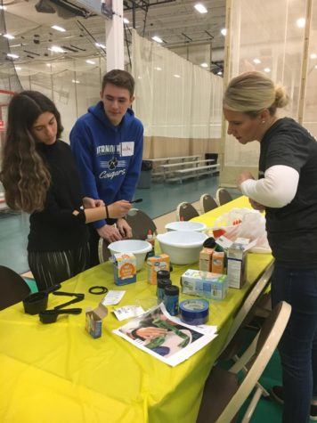 Student volunteers work with Mrs. Clarke to help make slime for the 75 participants at today’s SRA CLC Field Day at the Libertyville Sports Complex.