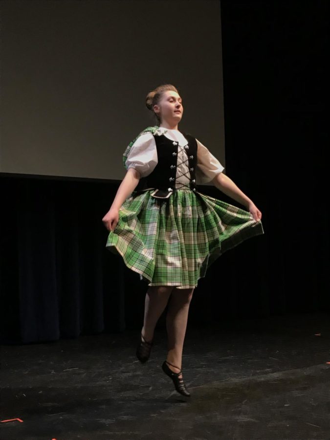 Girl in green dress as part of the Scottish dance performance at vhhs.