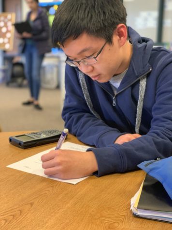 This is a photo of Jeffrey Zhang practicing math.