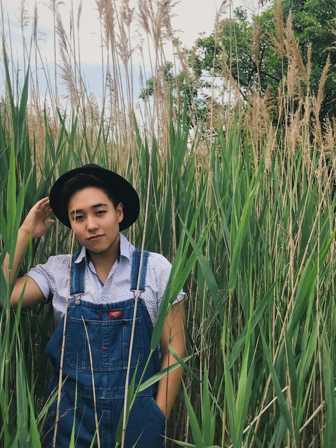 Picture of Wesley Kim standing in a field with an iconic outfit.