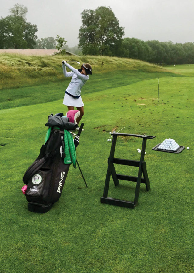 Lexi Schulman (9) holds her club in preparation to swing it