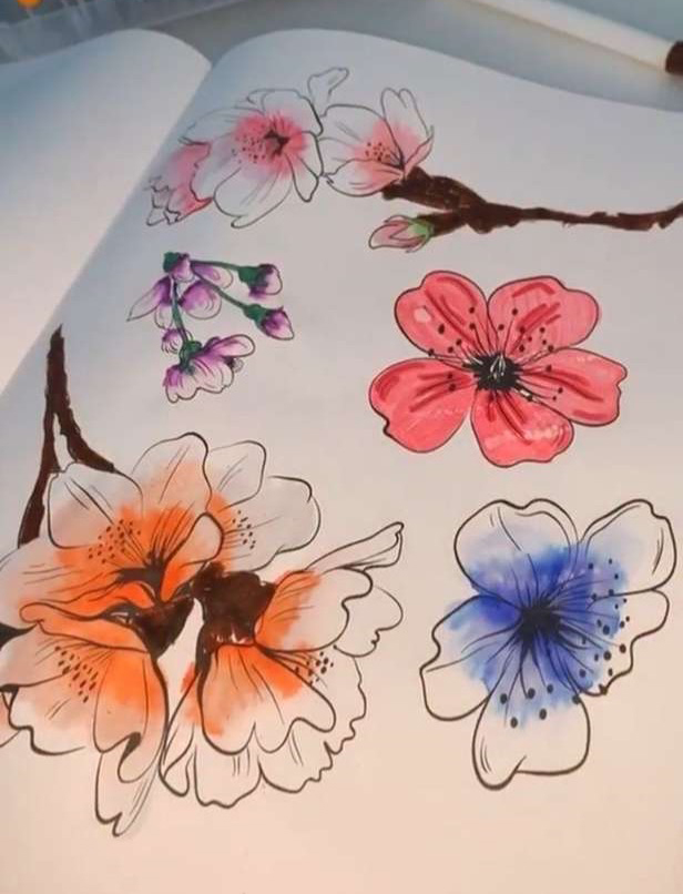 Water color flowers painted in a notebook.