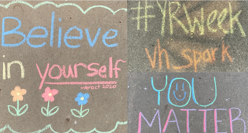 VHHS Interact member, Ashley Murphy (12), writes positive messages on her sidewalk for the Yellow Ribbon Week challenge.