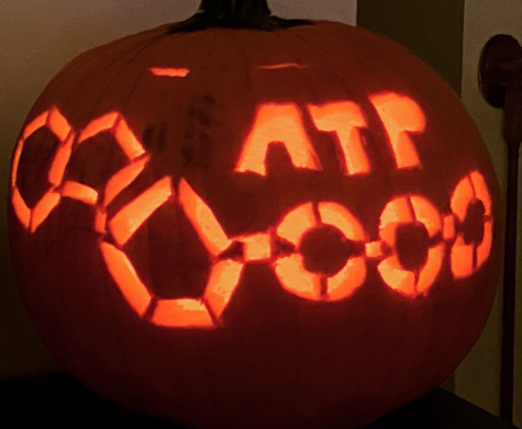 Pictured is a pumpkin with an ATP chemical carved onto it.