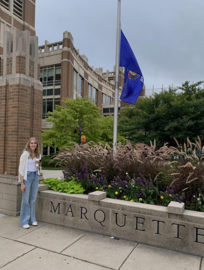 High School senior Abby Pedersen poses for photo in front of Marquette University sign