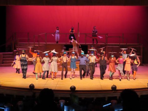 The cast of James and the Giant Peach form a line on stage while dancing during one of their numbers
