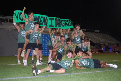 The Men in Green flash a “Vote Men In Green” sign and pose for the finale of their lip sync routine.