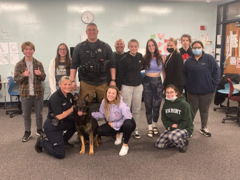 Law enforcement club poses with police dog