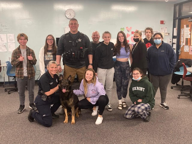 Law+enforcement+club+poses+with+police+dog