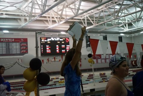 Coach, Andrea Block screams and cheers as the swimmers finish up their final laps in the 500.