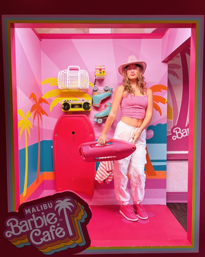 Lily Hetzel (10) poses as Barbie at the popup Malibu Barbie Cafe in Downtown Chicago.