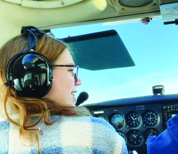Holly Faitsch (12) flies her mom along the coastline of Lake Michigan on a 1979 Cessna 172N.