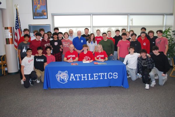 Andrew Laborevitch celebrating his commitment with his family, friends, and coaches at his signing.