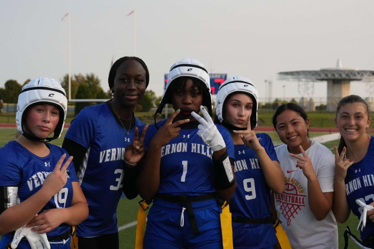 Players of the flag football team pose for a picture before the game starts.