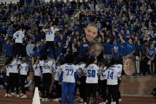 Student section cheers and roots for the 09/27's Homecoming football game against Main East.