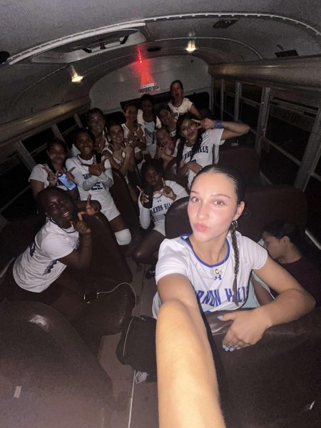 Players pose for a post game selfie in the bus.