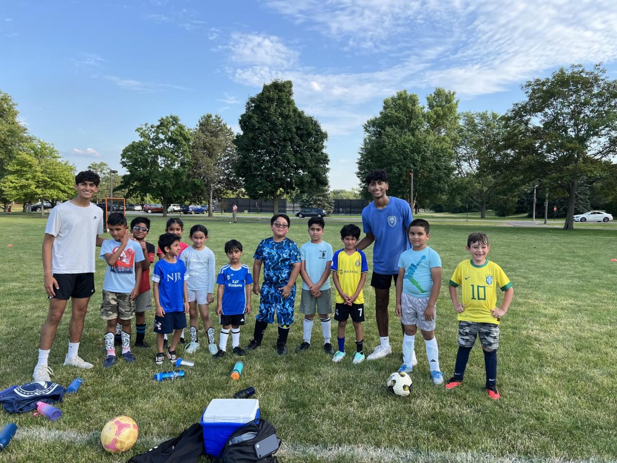 Siddharth Avula (12) and Aarav Sheth (11) coach soccer in the community.