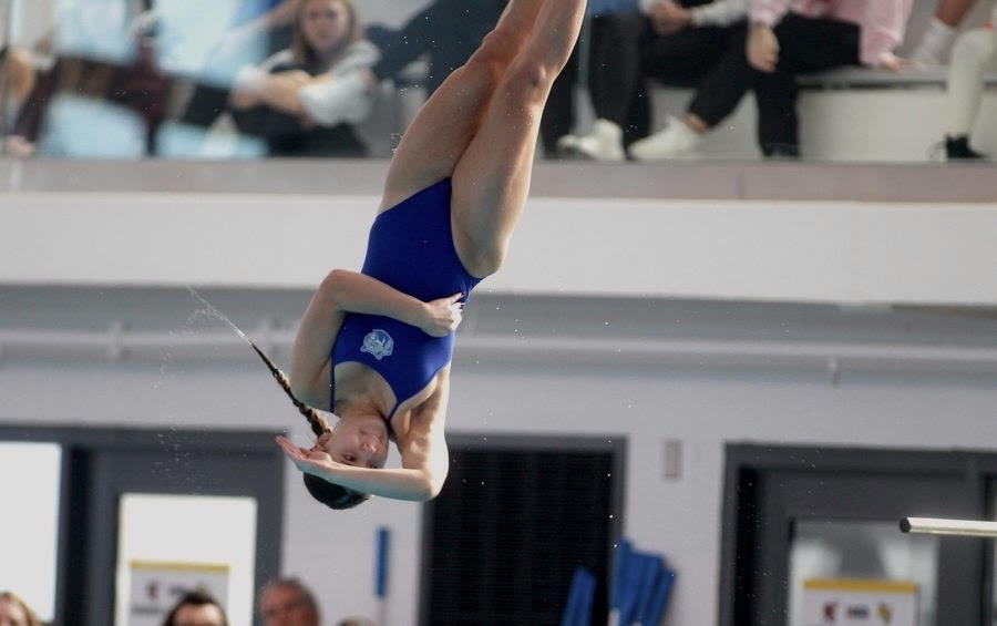 Livy Tran does a backflip at the IHSA State Finals in 2023.