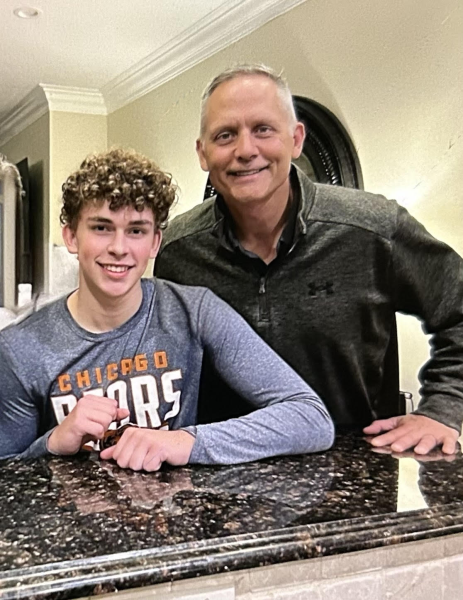 Nolan Brettner (11) and his father, math<br />teacher Paul Brettner smile for a picture.