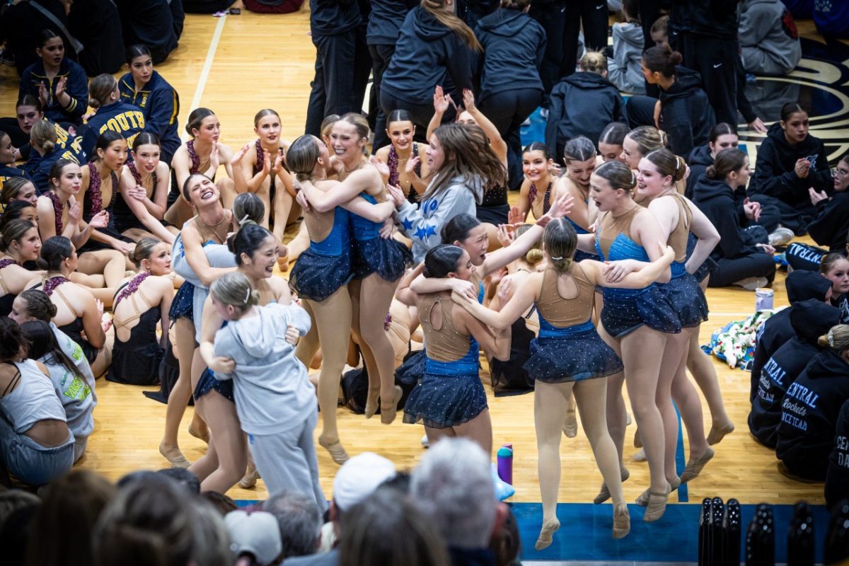 Dancers celebrate winning first place at the Lake Zurich competition.