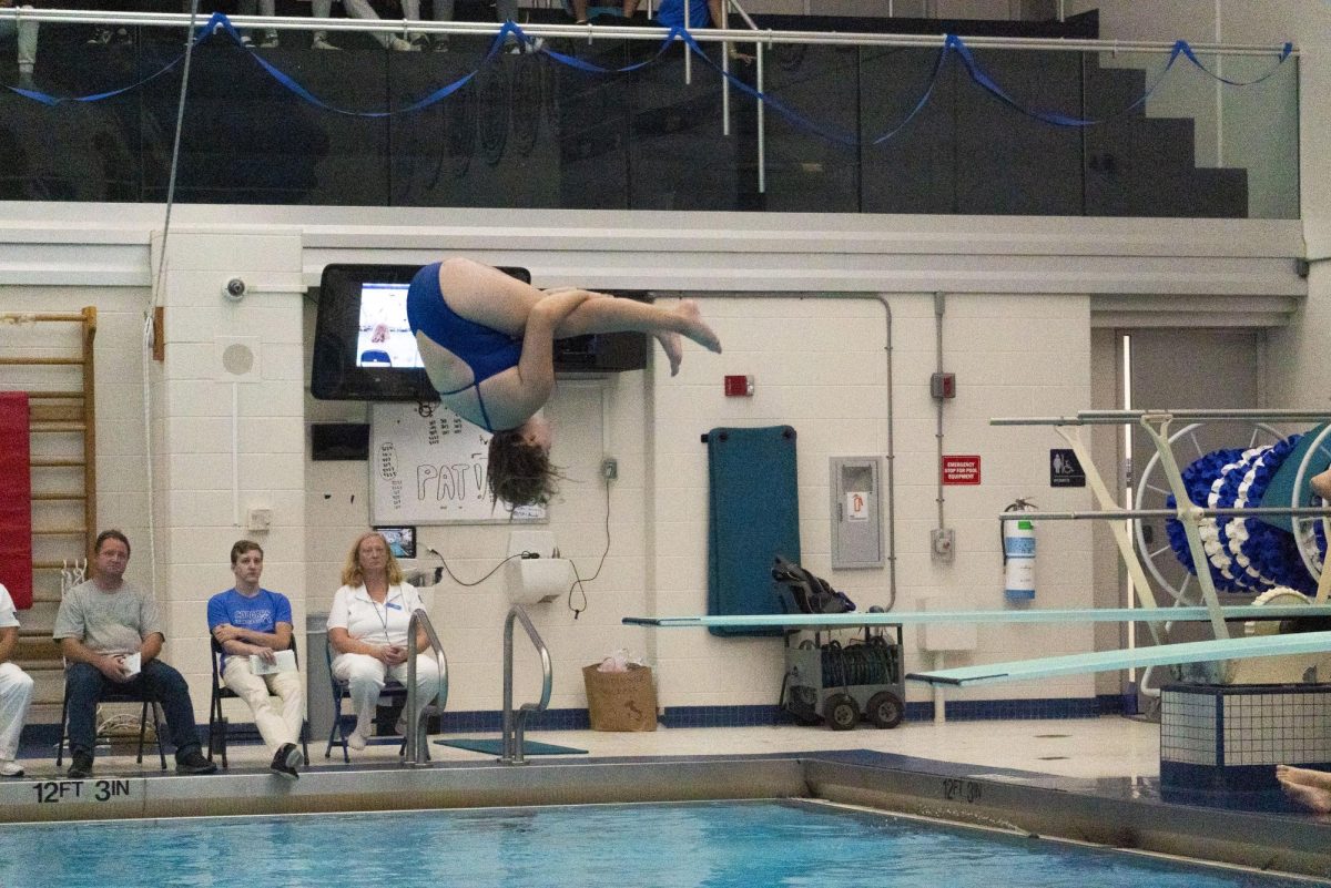 Violet Bossler dives into the VHHS swimming pool at Swim & Dive Senior Night.