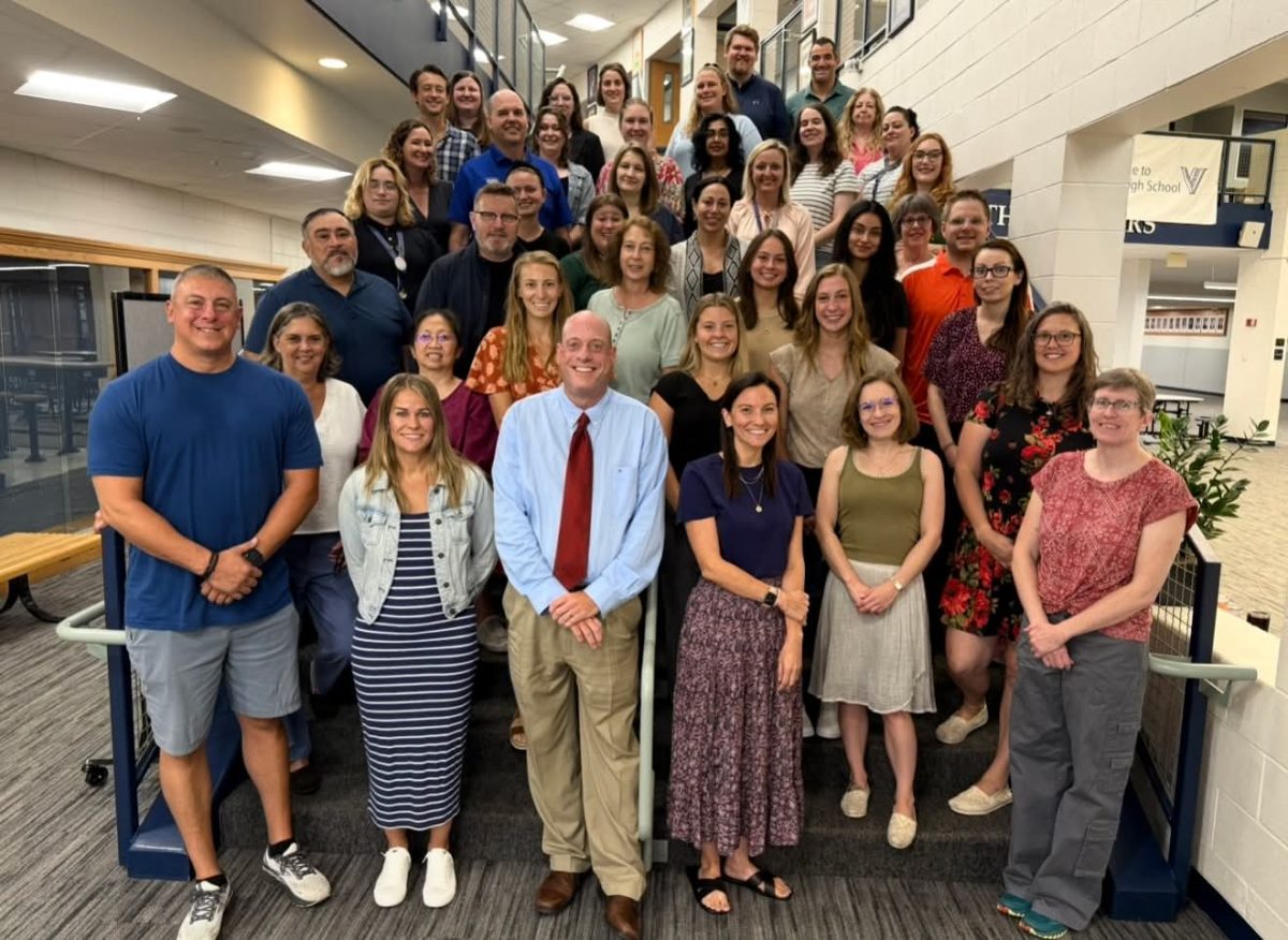 The new full-time and part-time staff members for District 128 pose as the school year starts.