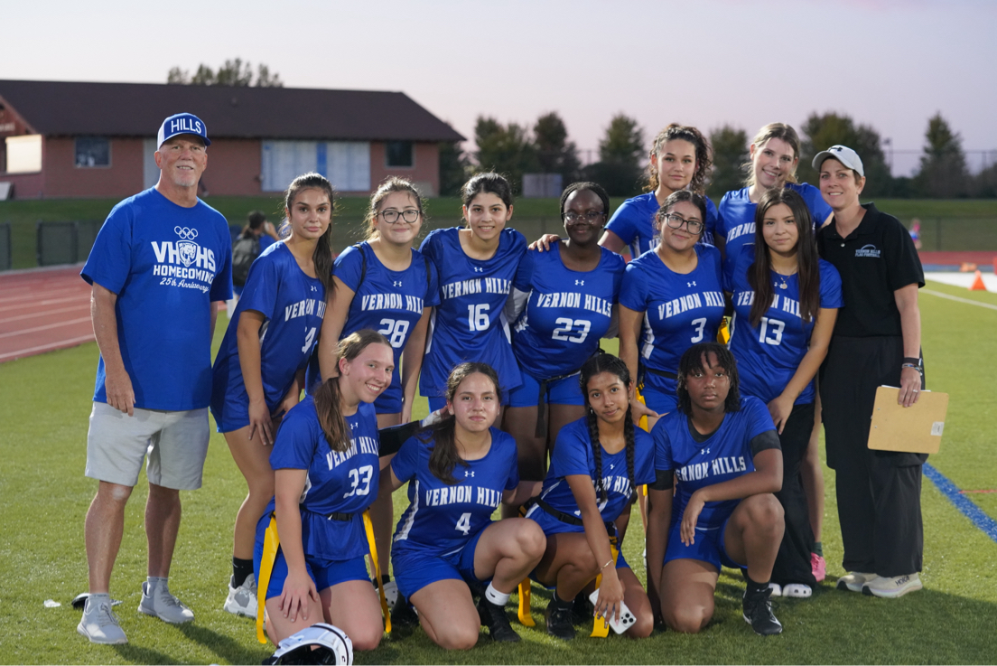 25' school year JV Girl's Flag Football team poses after a match on color competition day.